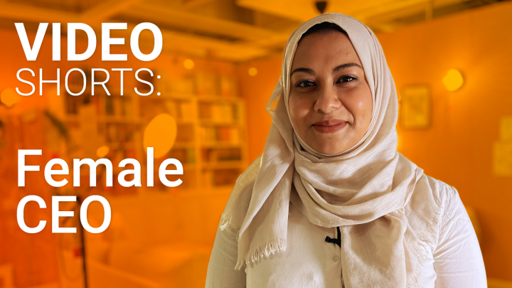 White text reads Video Shorts: Female CEO on an orange background with a photo of a smiling woman wearing a hijab