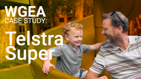 Text in white reads: WGEA Case Study Telstra Super. A close up side profile of a man looking at his son, a two-year-old boy with red hair. They are both smiling.